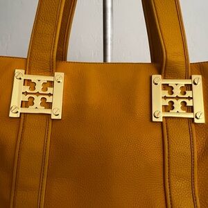 Tory Burch Yellow large Leather Tote with gold accents and dust cover.